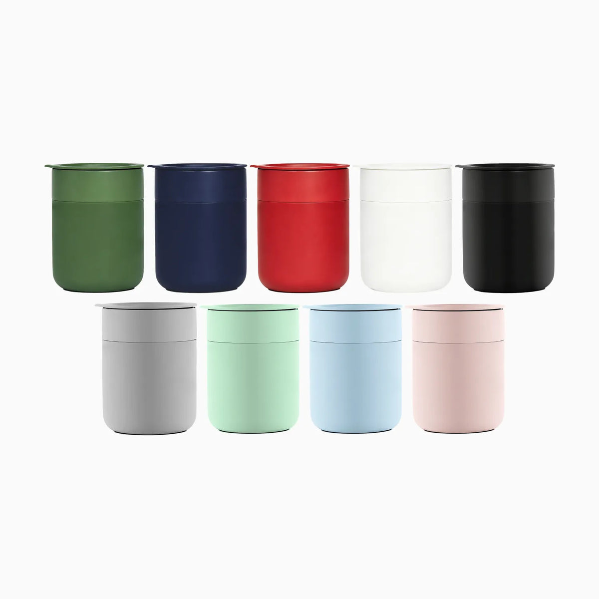 Eight reusable cylindrical containers in assorted colors, arranged in two rows on a plain white background. The top row includes green, navy, red, white, and black, and the bottom row includes light gray, mint green, soft blue, and blush pink.