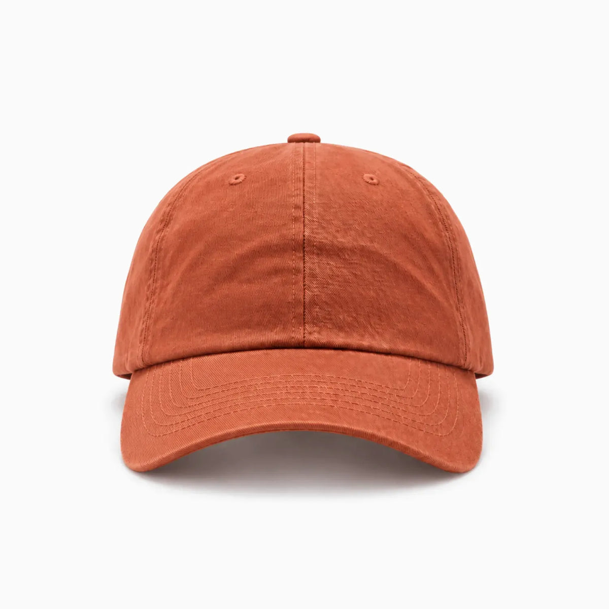 A classic six-panel dad hat in a burnt orange colour, shown from a front view angle on a clean background.