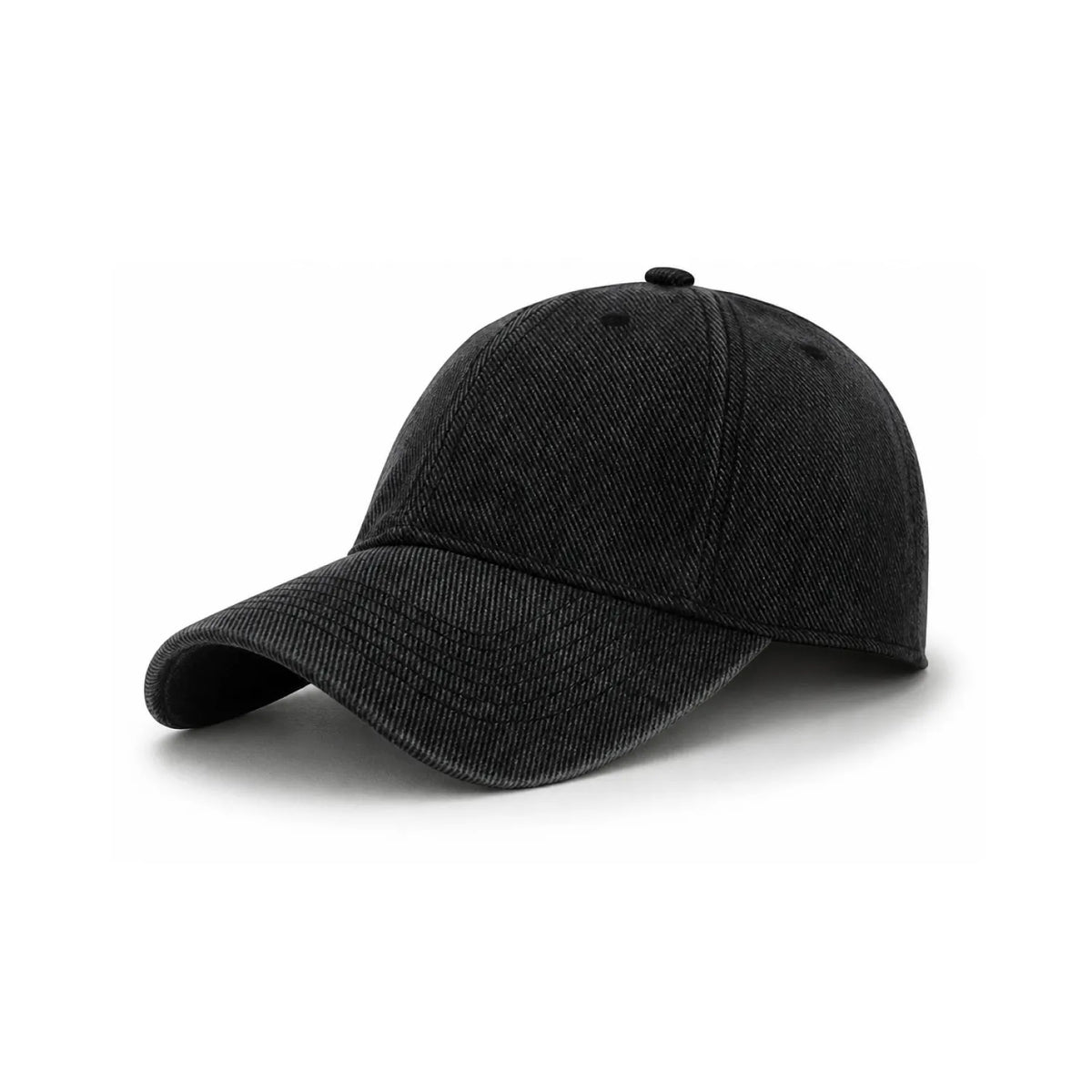 A classic six-panel cotton cap in a washed black fabric, shown from a three-quarter angle on a clean white background.