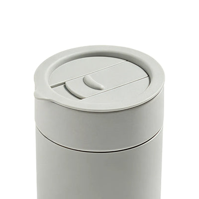 Gray coffee cup with a lid on a white background