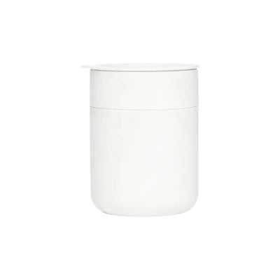 White ceramic jar with lid on a white background