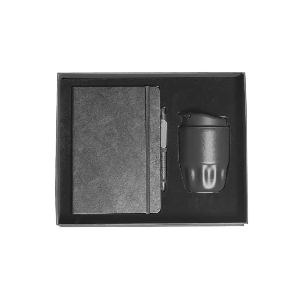 A5 Tyvek notebook, stone pen and black stainless steel insulated bottle in black magnetic gift box with foam insert, viewed from above, no branding applied