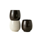 Off-white and dark brown aroma recycled coffee grounds coffee cups stacked and grouped on a white background, showing both colourways, no branding applied