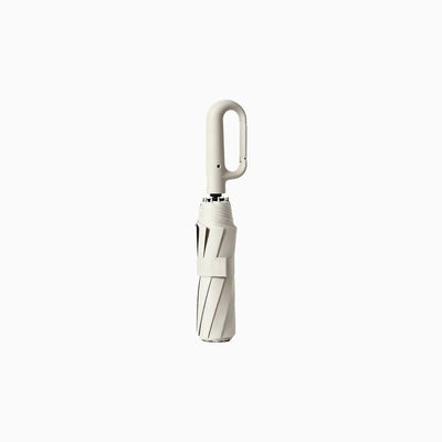 Custom branded carabiner handle folding umbrella in cream white, bulk corporate merch Australia by Wumble Merch