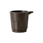 Dark brown 90ml Doric recycled coffee grounds tasting cup on a white background, three-quarter view showing the vertical ribbed Doric profile and side lanyard tab, no branding applied