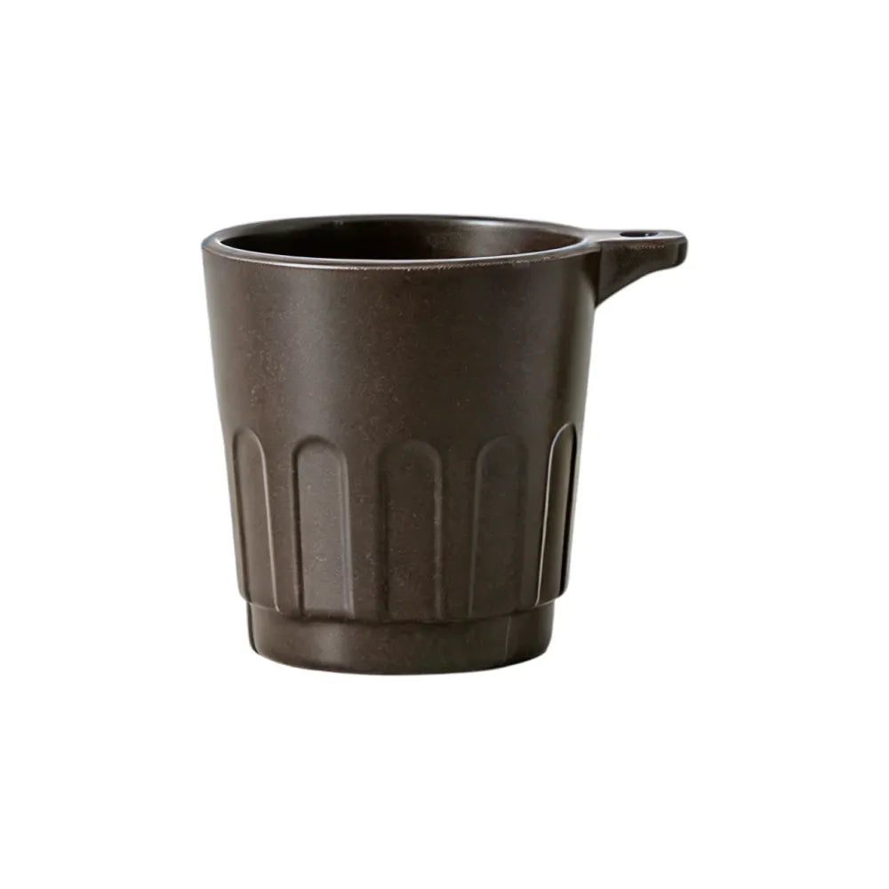 Dark brown 90ml Doric recycled coffee grounds tasting cup on a white background, three-quarter view showing the vertical ribbed Doric profile and side lanyard tab, no branding applied