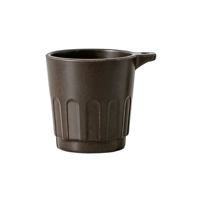 Dark brown 90ml Doric recycled coffee grounds tasting cup on a white background, three-quarter view showing the vertical ribbed Doric profile and side lanyard tab, no branding applied