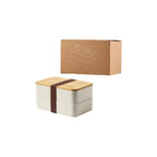 Wheat straw double-layer lunch box beside its printed kraft gift box on a white background, no Wumble branding applied