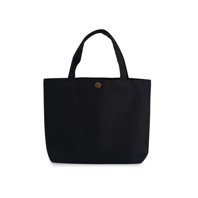 A black canvas gusseted tote bag with two top handles and a small round gold-tone button closure at the top center, shown against a plain white background.
