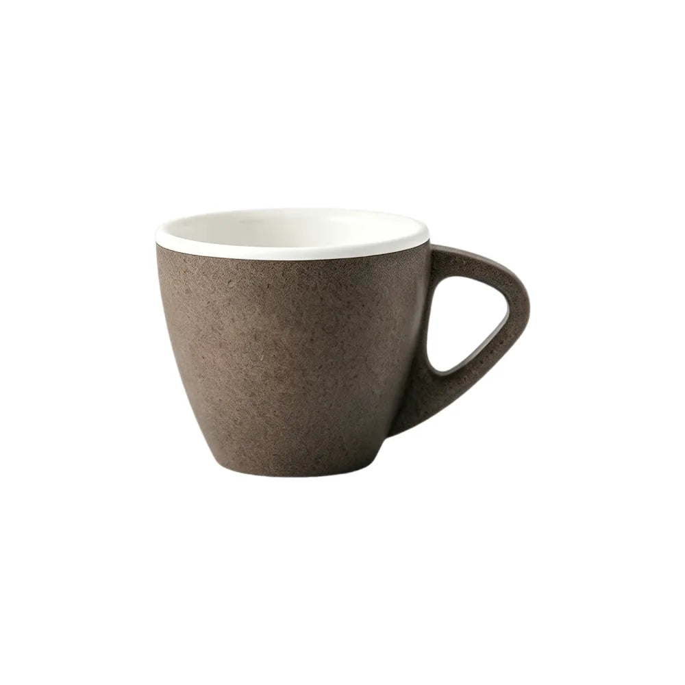 Coffee brown 60ml PLA espresso tasting cup with a white interior and triangular handle on a white background, no branding applied