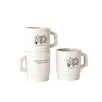 Off-white retro stackable recycled coffee grounds mugs printed with a sample character motif and a "made with recycled coffee grounds" line, white background, branded example