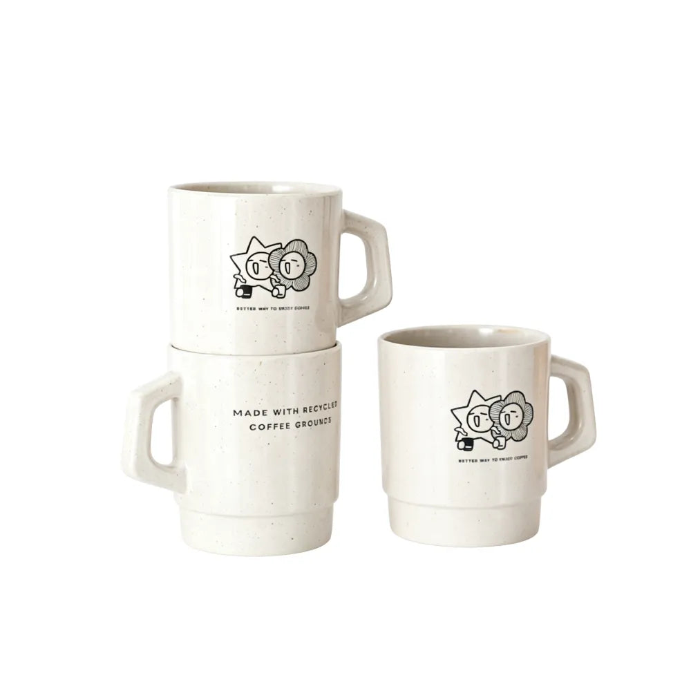 Off-white retro stackable recycled coffee grounds mugs printed with a sample character motif and a "made with recycled coffee grounds" line, white background, branded example