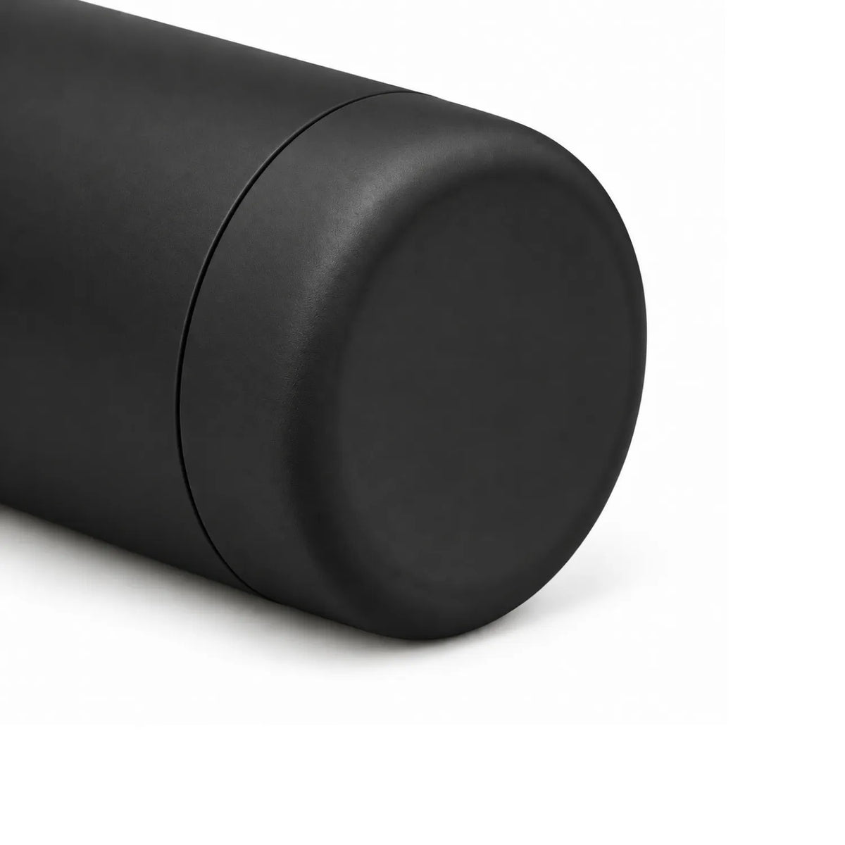 Close view of a black drink bottle base, showing a rounded edge and a fine seam ring.