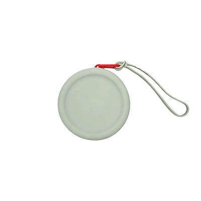 Custom branded round silicone cable pouch in sage grey with orange zipper, bulk tech merch Australia by Wumble