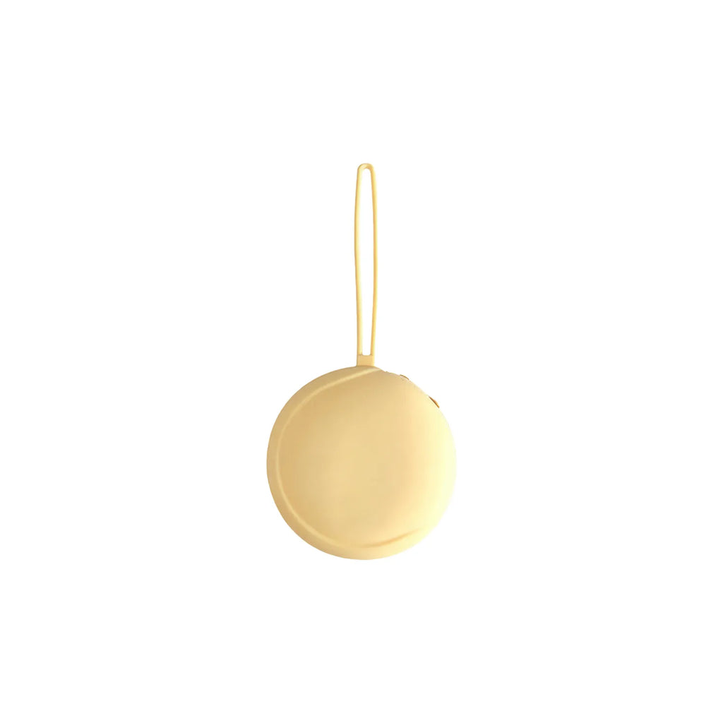 Butter yellow round silicone zip pouch on a white background with its silicone hanging loop, no Wumble branding applied