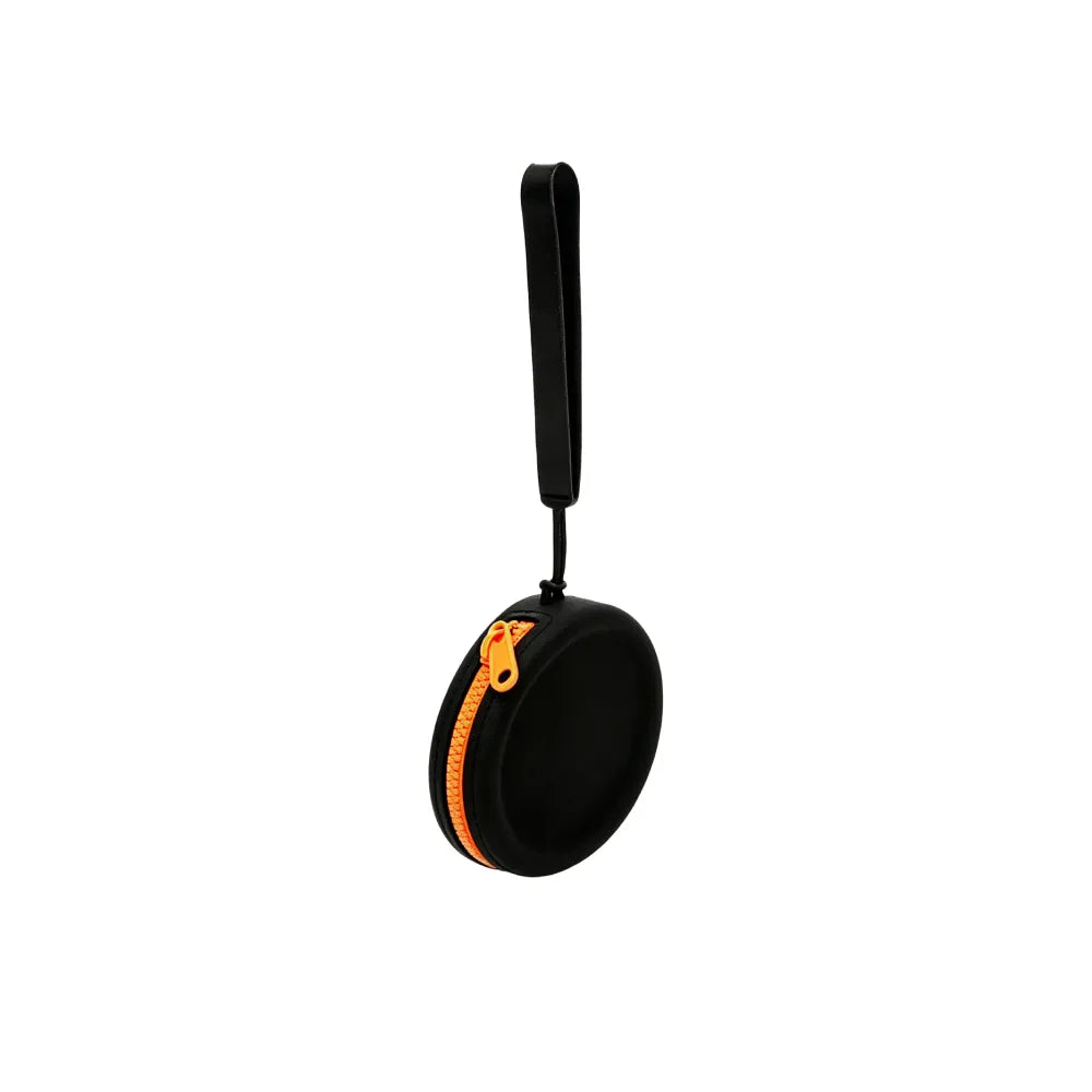 Custom branded round silicone cable pouch in black with orange zipper, bulk tech merch Australia by Wumble