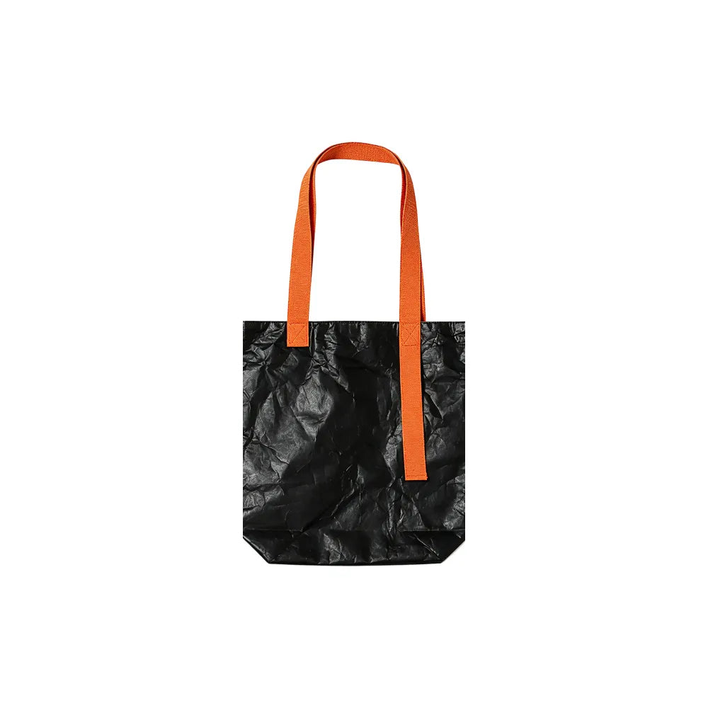 Custom branded Tyvek paper tote bag in black with orange cotton handles, bulk eco event bag Australia by Wumble Merch