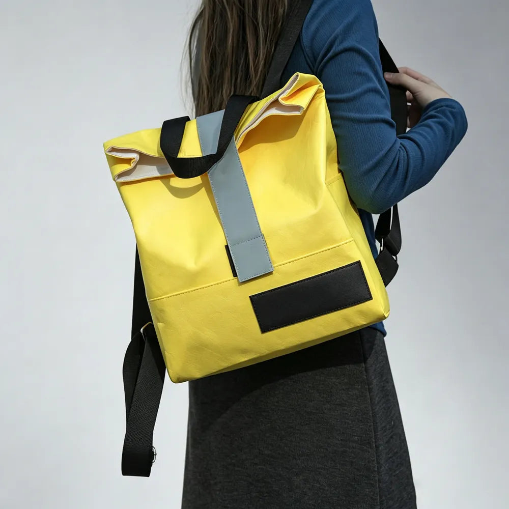 Person wearing custom branded Tyvek roll-top backpack, sustainable event merch by Wumble Merch Australia