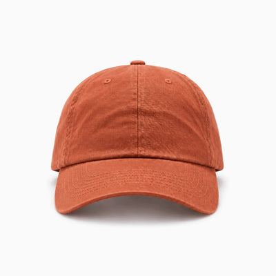 A classic six-panel dad hat in a burnt orange colour, shown from a front view angle on a clean background.