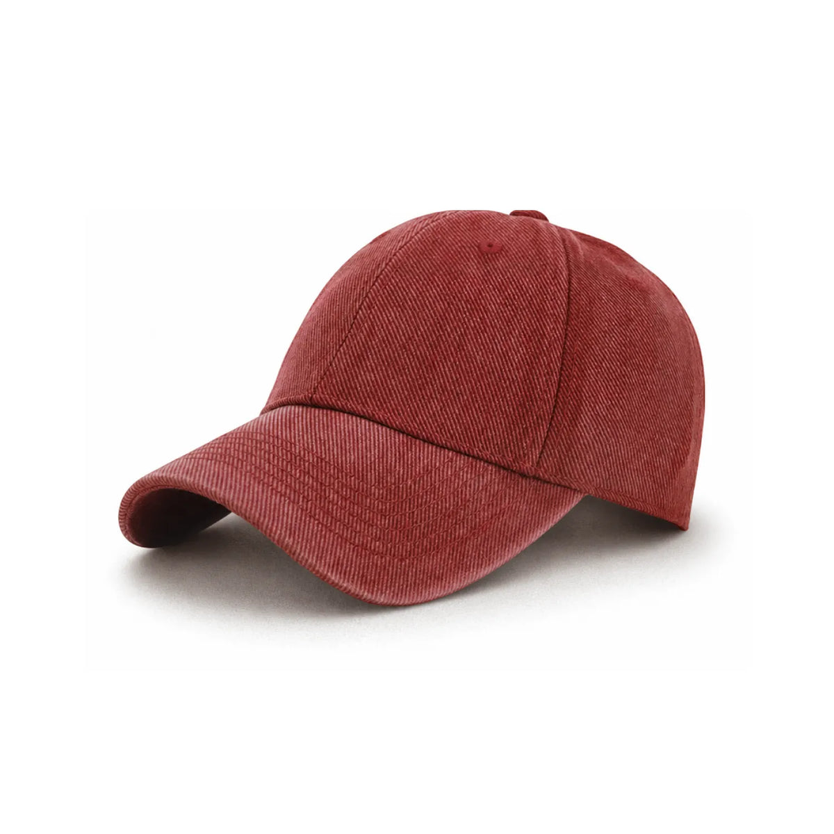 A classic six-panel cap in a washed, rust red fabric, shown from a three-quarters angle on a white background.