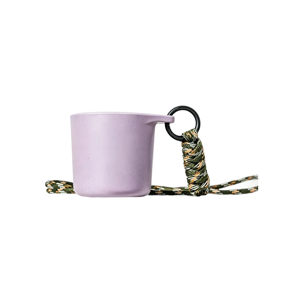 Misty lavender water drop recycled coffee grounds tasting cup on a white background with a camouflage braided lanyard, speckled finish, no branding applied
