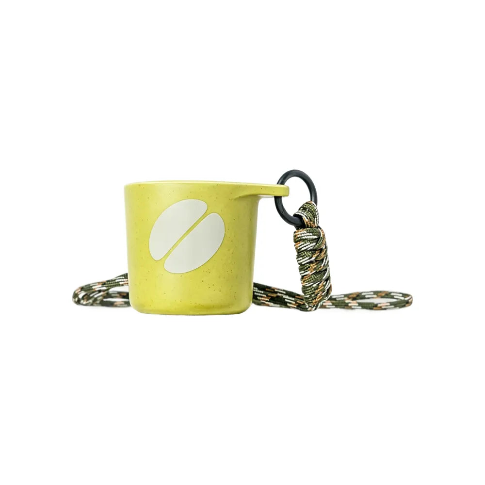 Pear green water drop recycled coffee grounds tasting cup printed with a cream coffee bean motif, camouflage braided lanyard, sample branding example