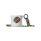 White water drop recycled coffee grounds tasting cup printed with a brown coffee bean motif and Re-generation wordmark, camouflage braided lanyard, sample branding example