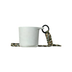 White speckled water drop recycled coffee grounds tasting cup viewed from the front on a white background with a camouflage braided lanyard, no branding applied