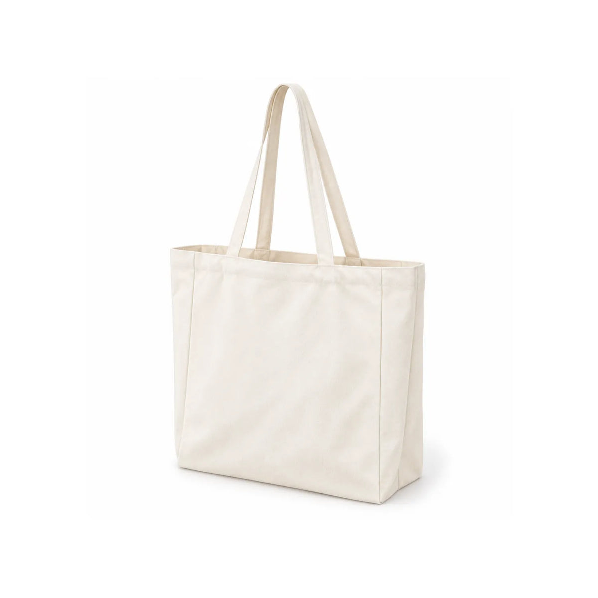A plain canvas tote bag in a off-white at three-quarter angle, featuring two long shoulder straps, shown on a clean white background.
