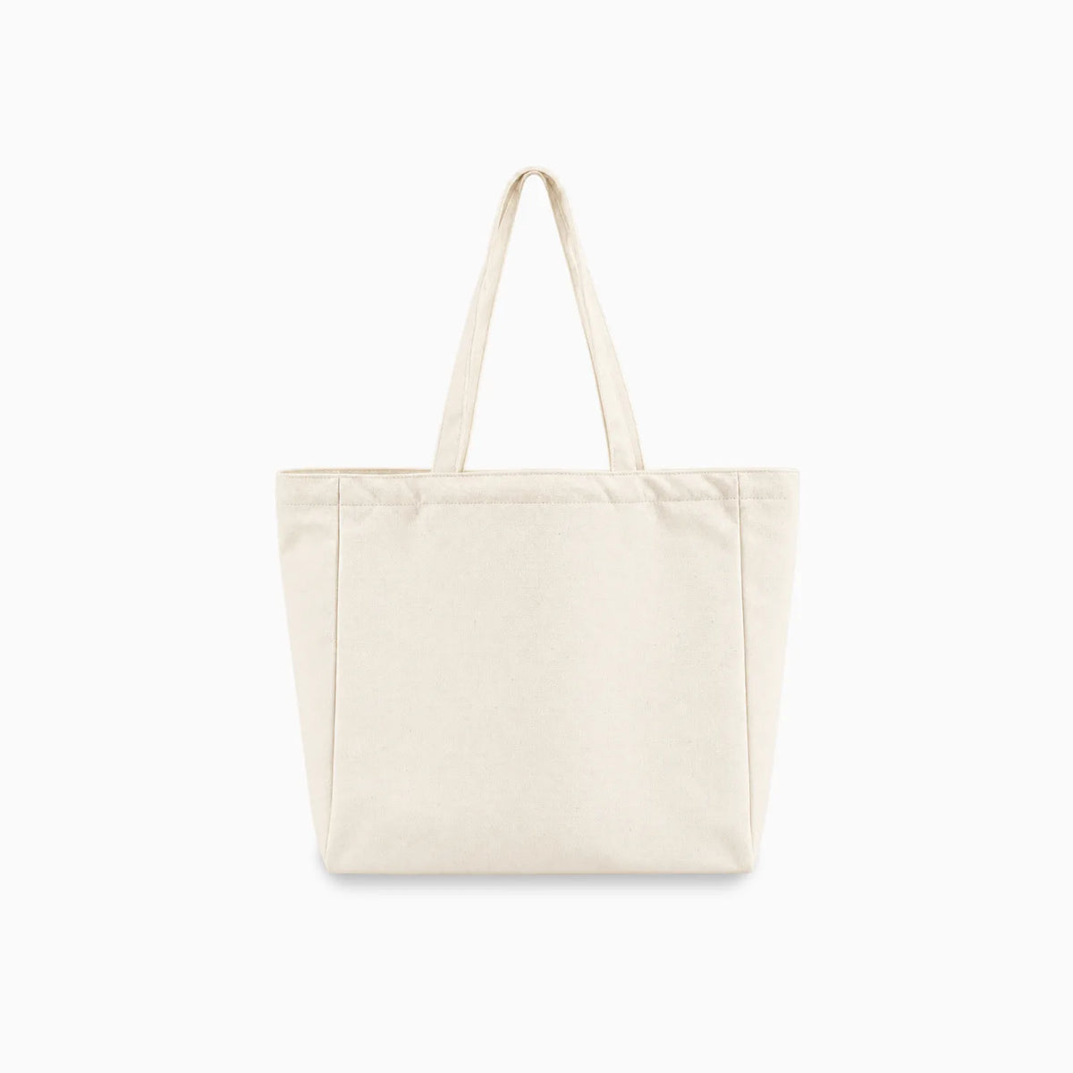 A plain canvas tote bag in a light cream or off-white color, featuring two long shoulder straps and a structured rectangular shape, shown against a solid white background.